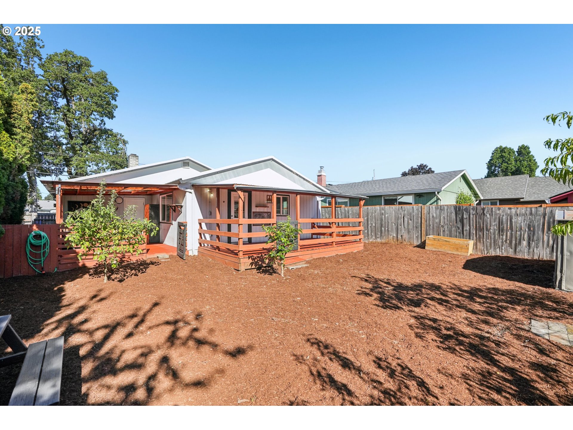 1019 Linn Avenue Oregon City, OR 97045 - Photo 23 of 27 a view of a house with wooden deck and furniture