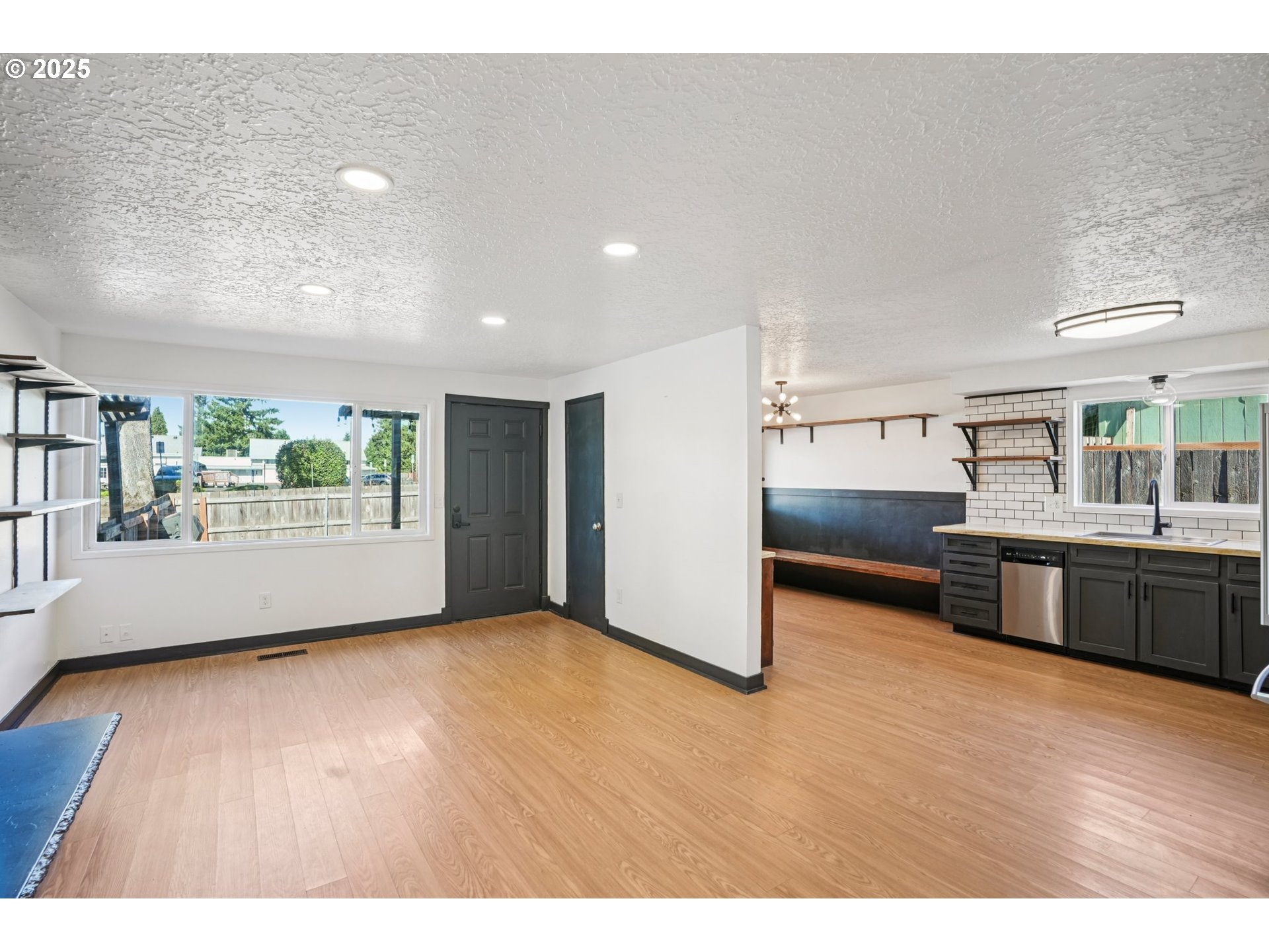 1019 Linn Avenue Oregon City, OR 97045 - Photo 8 of 27 a view of an empty room with window and wooden floor