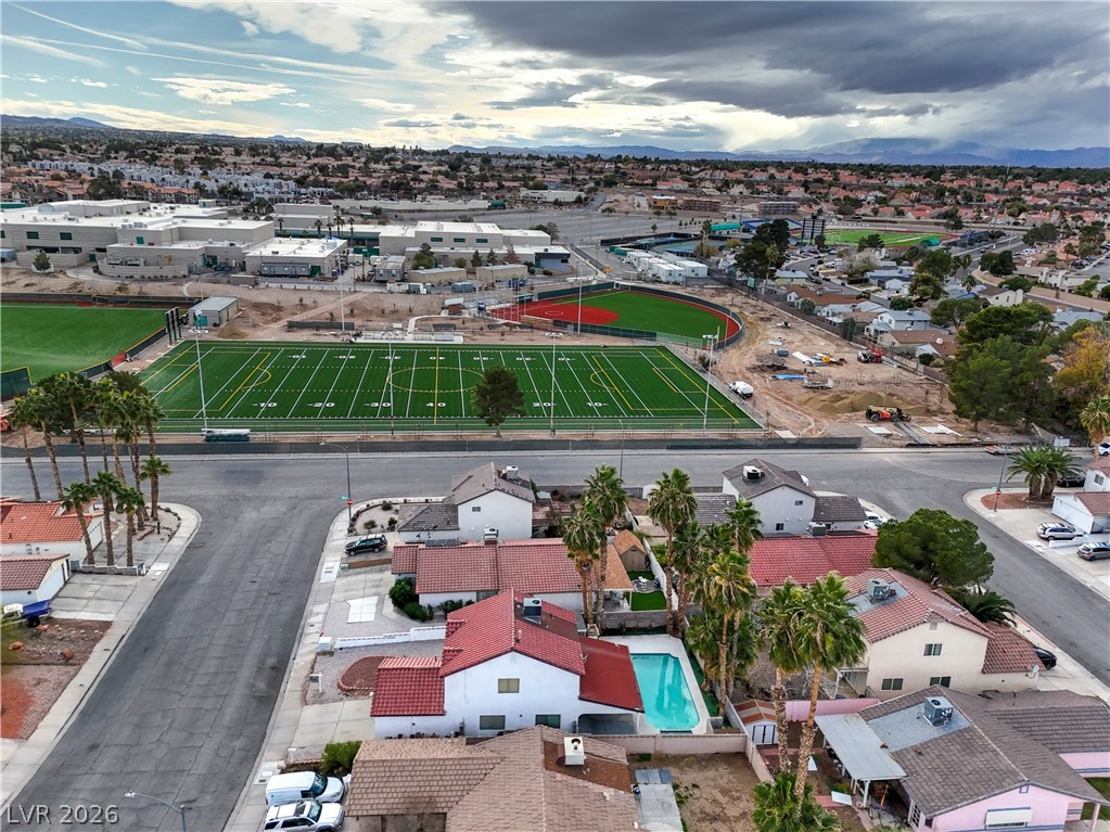 581 Carleton Drive Henderson, NV 89014 - Photo 31 of 37 An aerial perspective reveals a vibrant neighborhood alongside a school and expansive sports facilities.