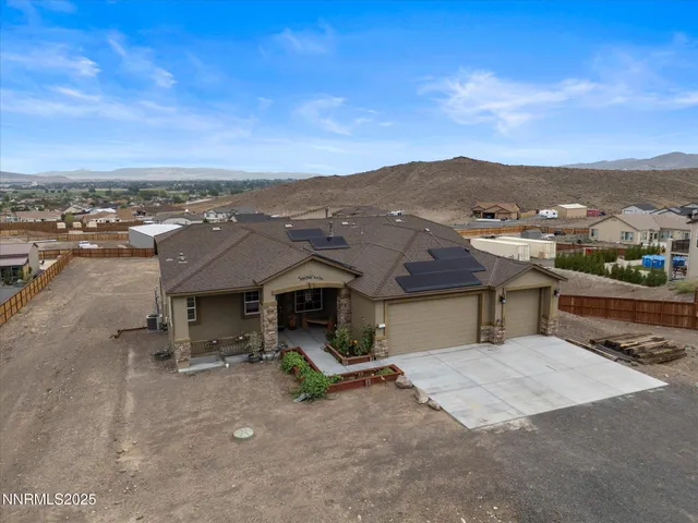 an aerial view of a house with a garden
