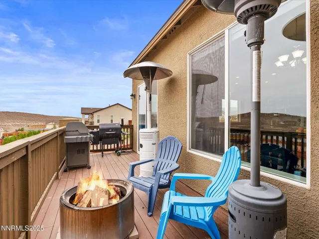 a view of a patio with table and chairs