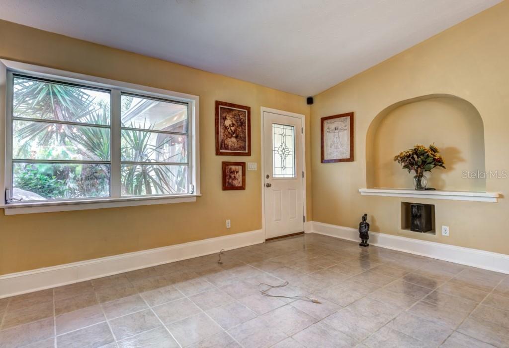 1453 Nantucket Road Venice, FL 34293 - Photo 7 of 35 The great room features double windows and a designer glass paneled front door allowing loads of natural light to shine in.