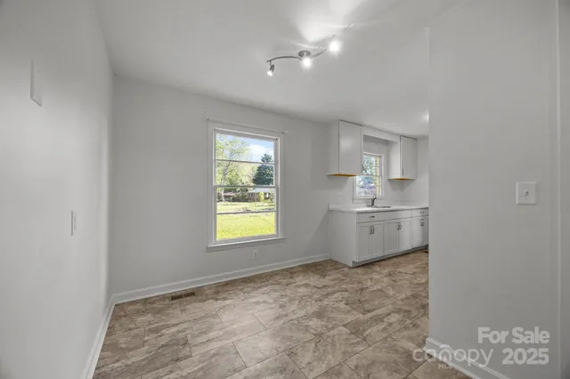 a view of kitchen and windows