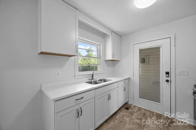 a bathroom with a sink a vanity and a mirror