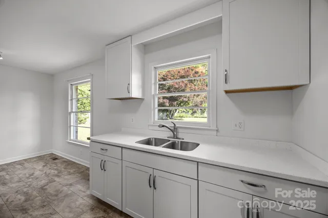 a kitchen with a sink and a window