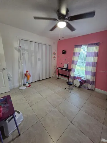 a view of a livingroom with furniture and a flat screen tv