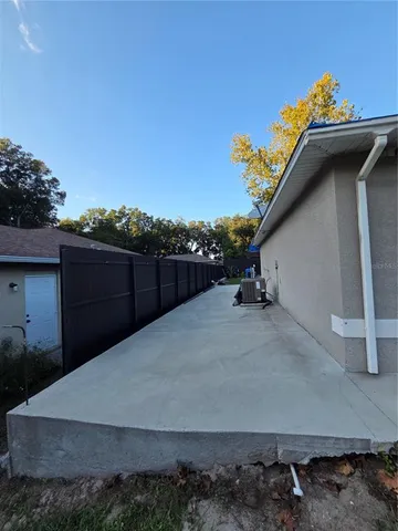 a backyard of a house with lots of green space