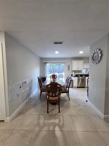 a view of a dining room with furniture and a livingroom