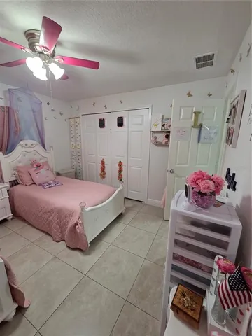 a bathroom with a sink a toilet and shower curtain