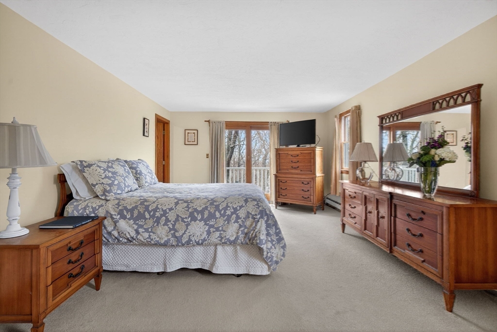 32 Howe Road Cohasset, MA 02025 - Photo 23 of 25 a bedroom with a bed and a dresser