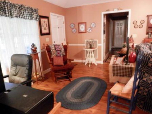 495 Stone Edge Road, Unit 45 Macon, GA 31210 - Photo 3 of 10 a living room with furniture and wooden floor