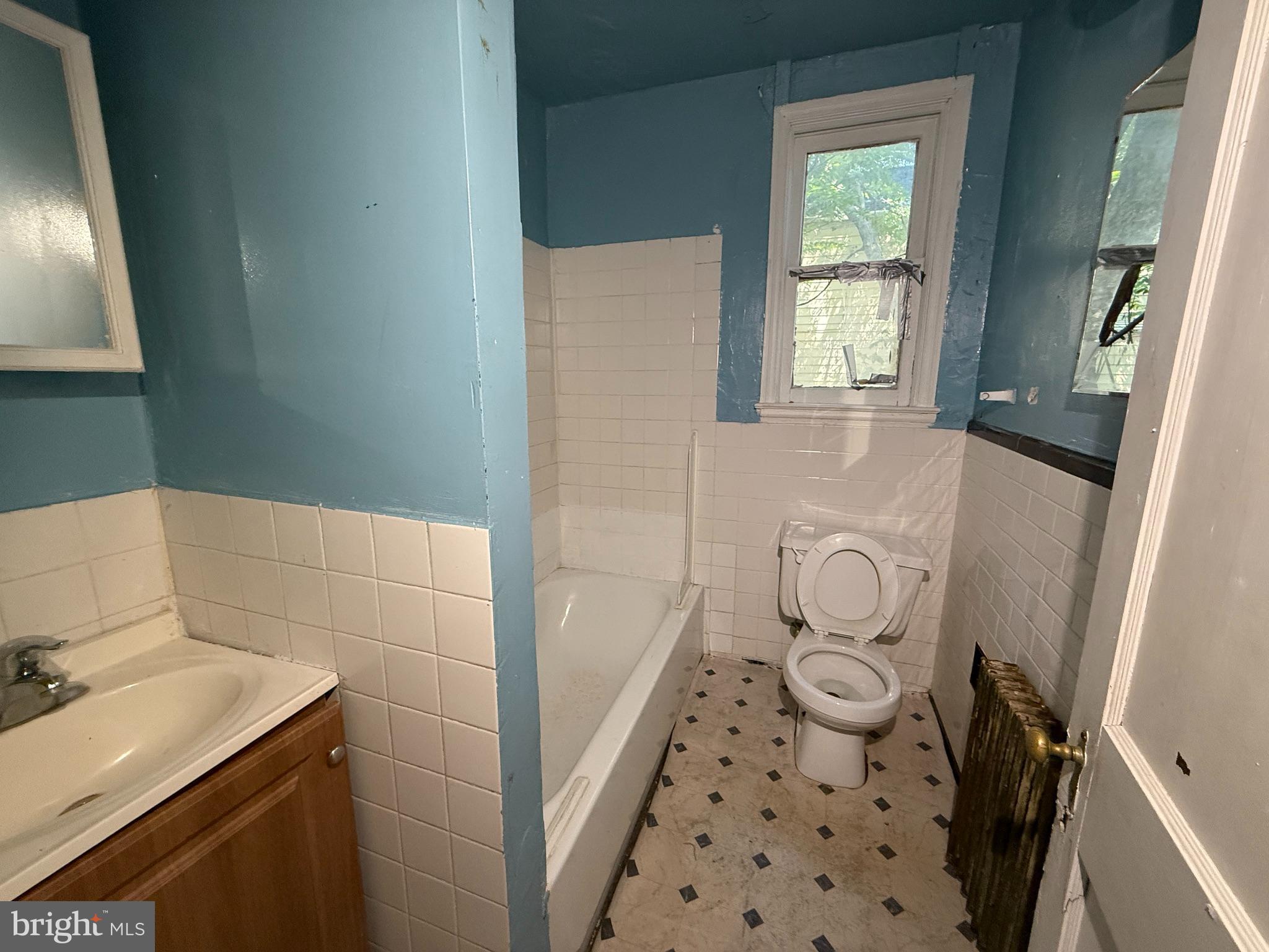 38 North Monastery Avenue Baltimore, MD 21229 - Photo 11 of 17 a bathroom with a sink and a mirror