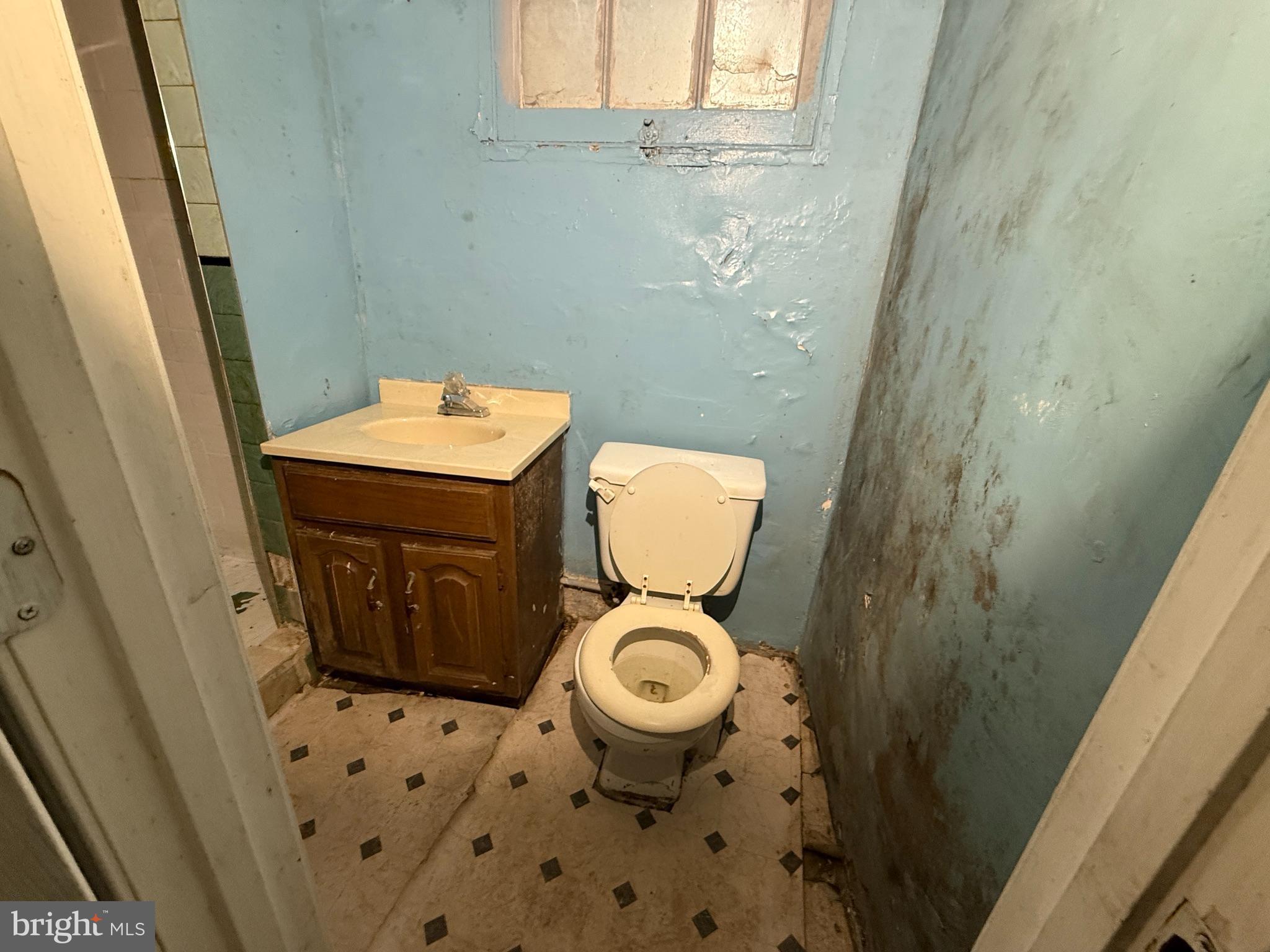 38 North Monastery Avenue Baltimore, MD 21229 - Photo 15 of 17 a bathroom with a sink and a toilet