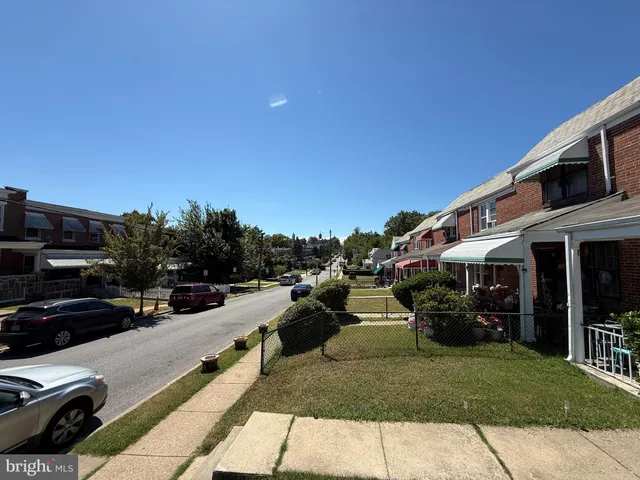 a view of a street with cars on road