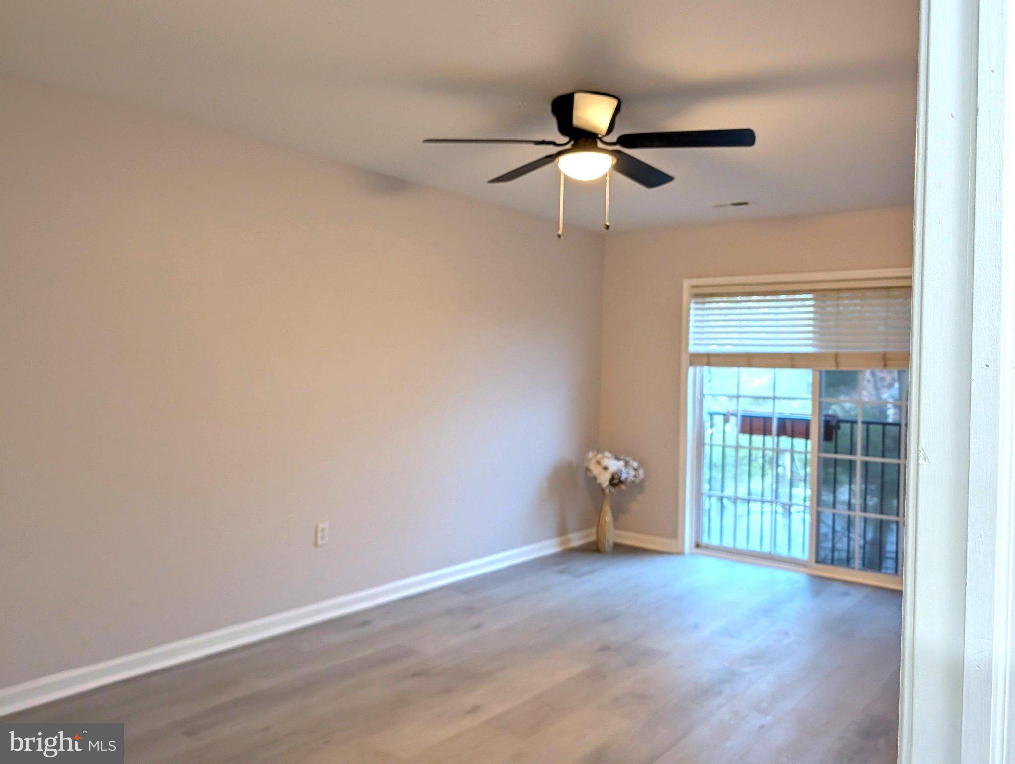 9228 Blue Grass Road, Unit 30 Philadelphia, PA 19114 - Photo 6 of 11 a view of an empty room with a window