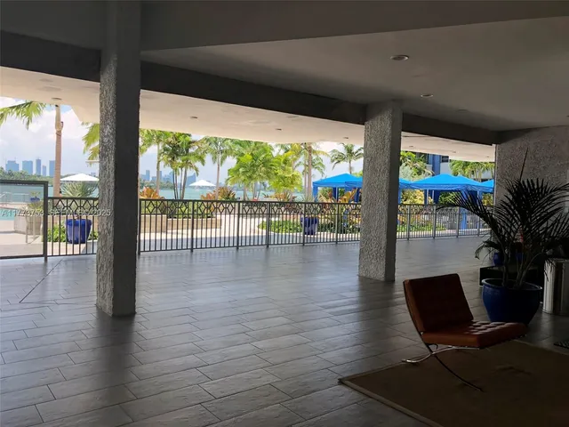 a view of a floor to ceiling window with wooden floor