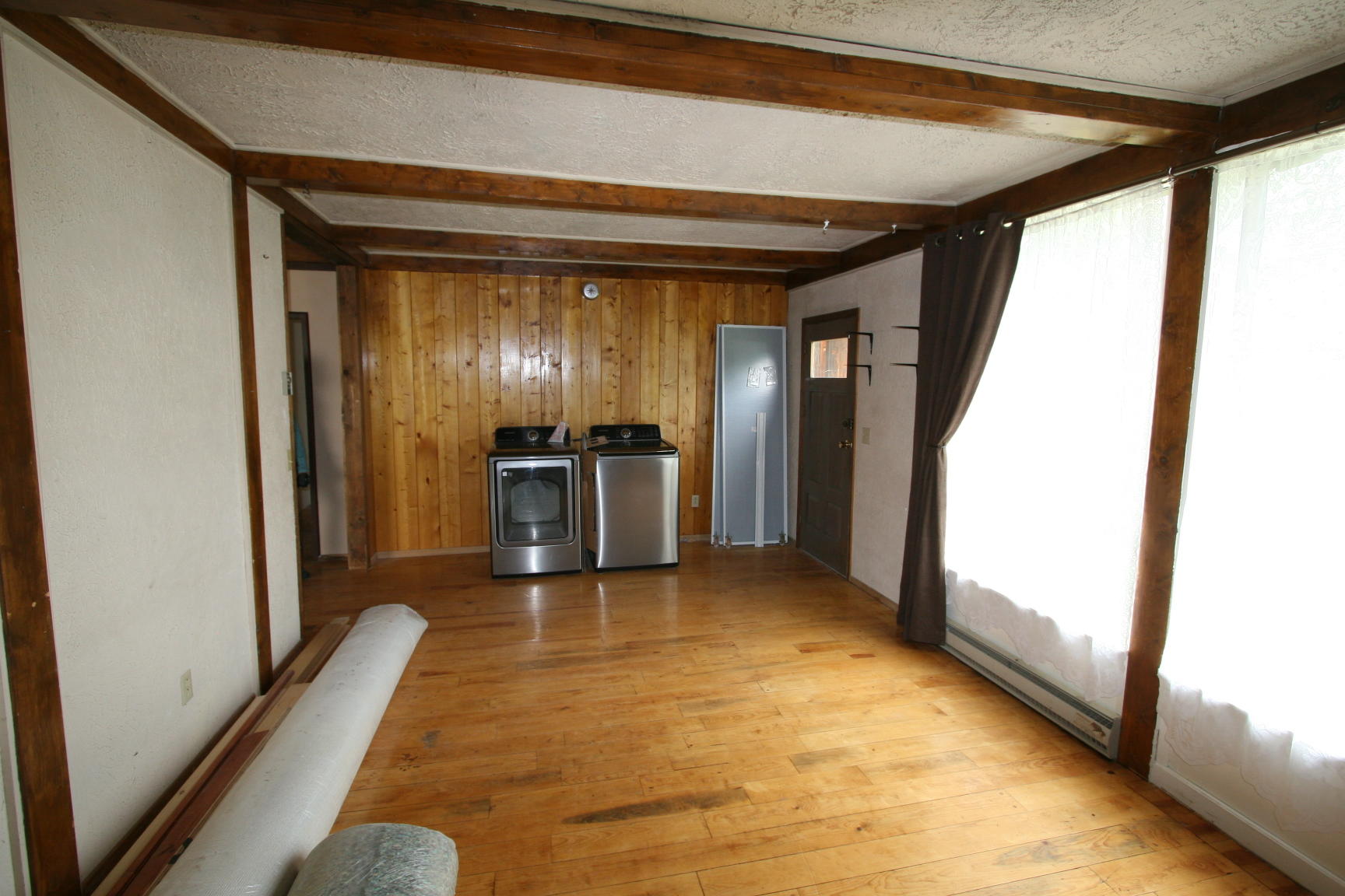 35310 Highway 145 Redvale, CO 81431 - Photo 16 of 38 a view of a hallway with wooden floor