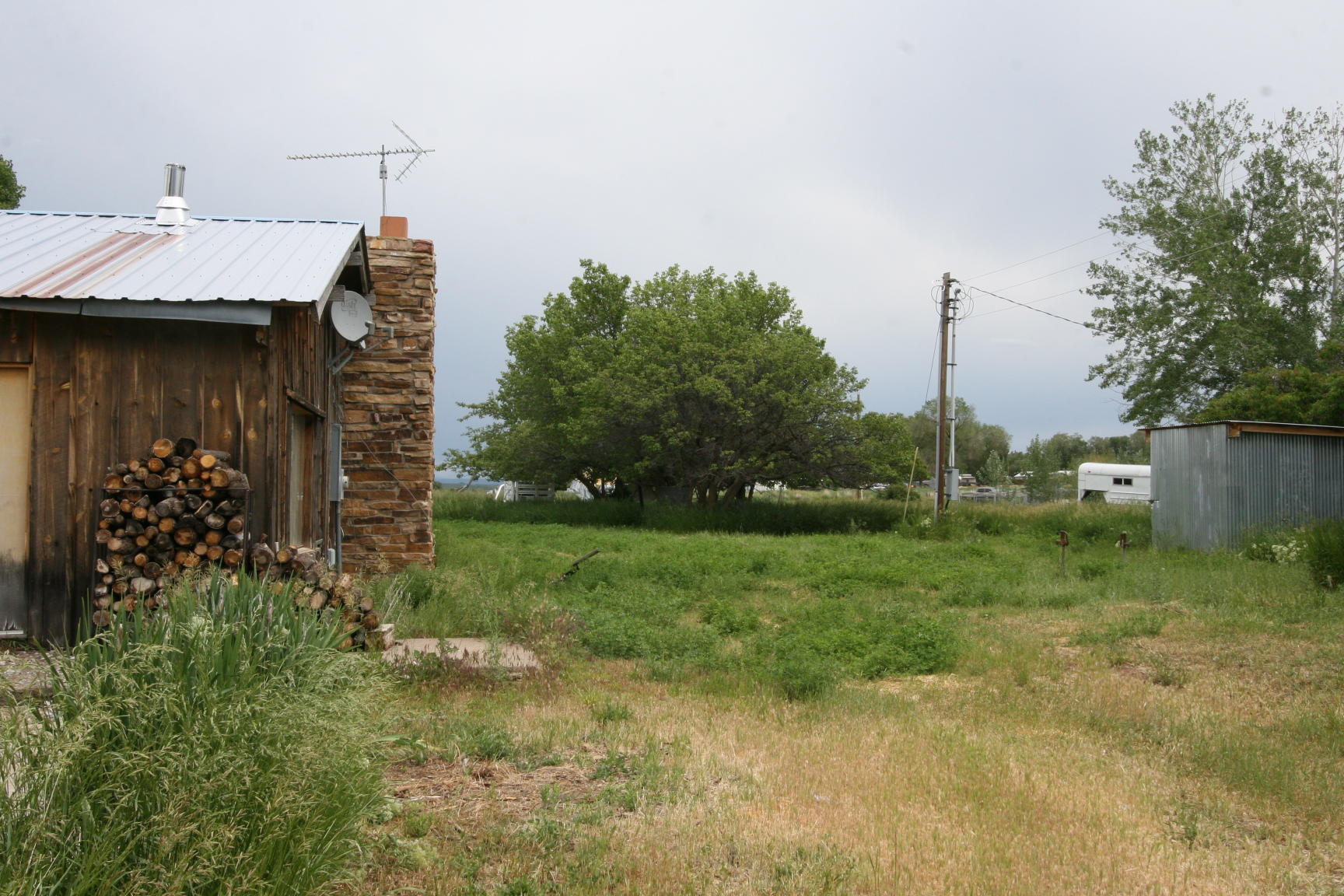 35310 Highway 145 Redvale, CO 81431 - Photo 34 of 38 a backyard of a house with lots of green space