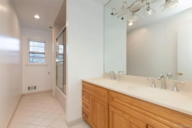 a bathroom with a sink a vanity and a mirror