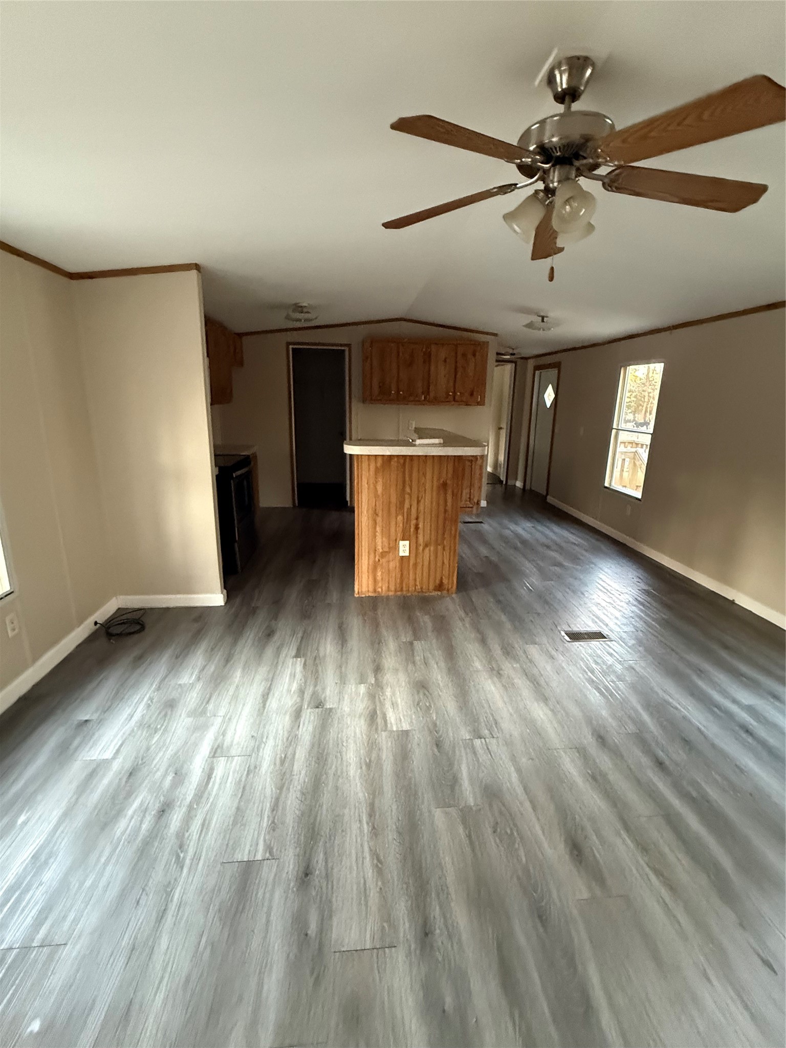 144 Private Road Cleveland, TX 77327 - Photo 15 of 17 a view of a room with wooden floor ceiling fan and windows