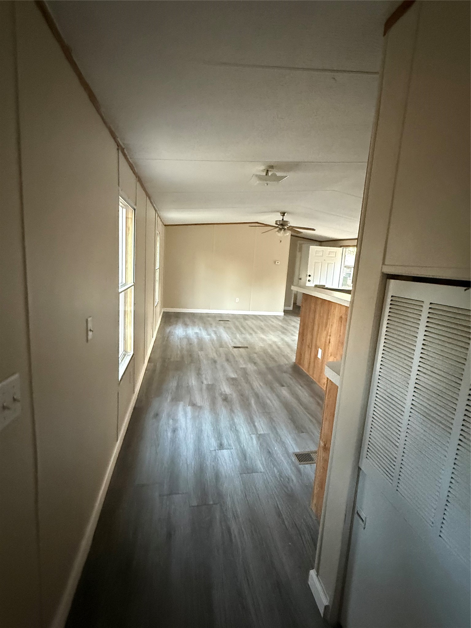 144 Private Road Cleveland, TX 77327 - Photo 6 of 17 wooden floor in an empty room with a window