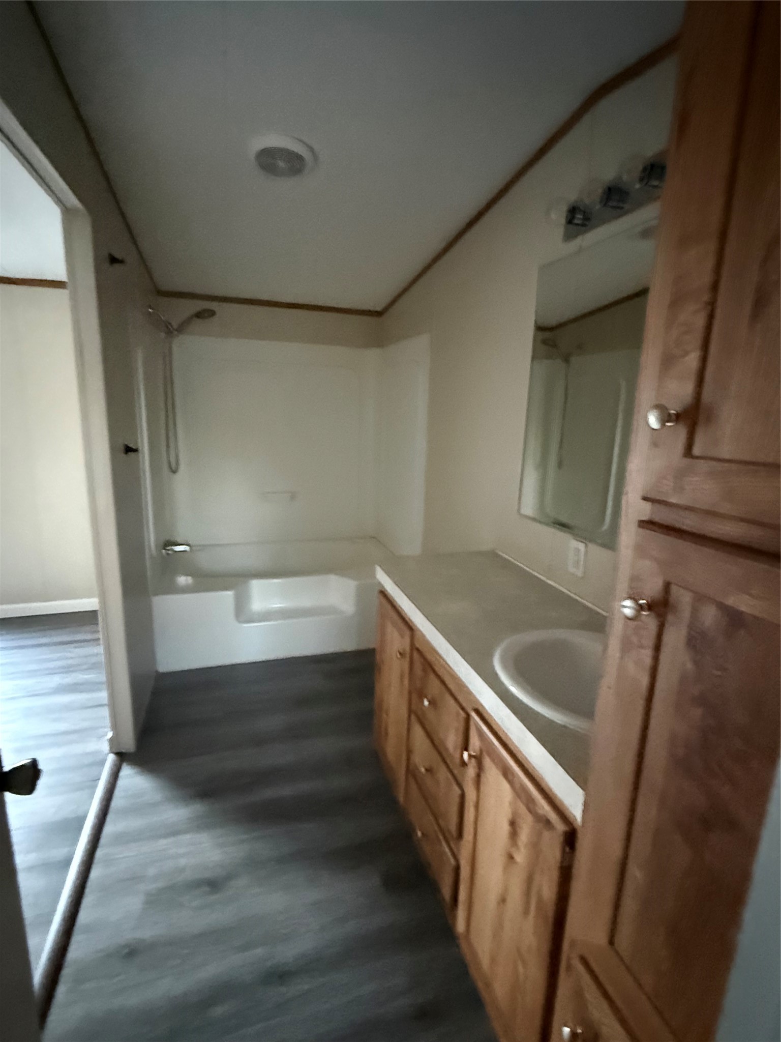 144 Private Road Cleveland, TX 77327 - Photo 7 of 17 a kitchen with sink cabinets and wooden floor