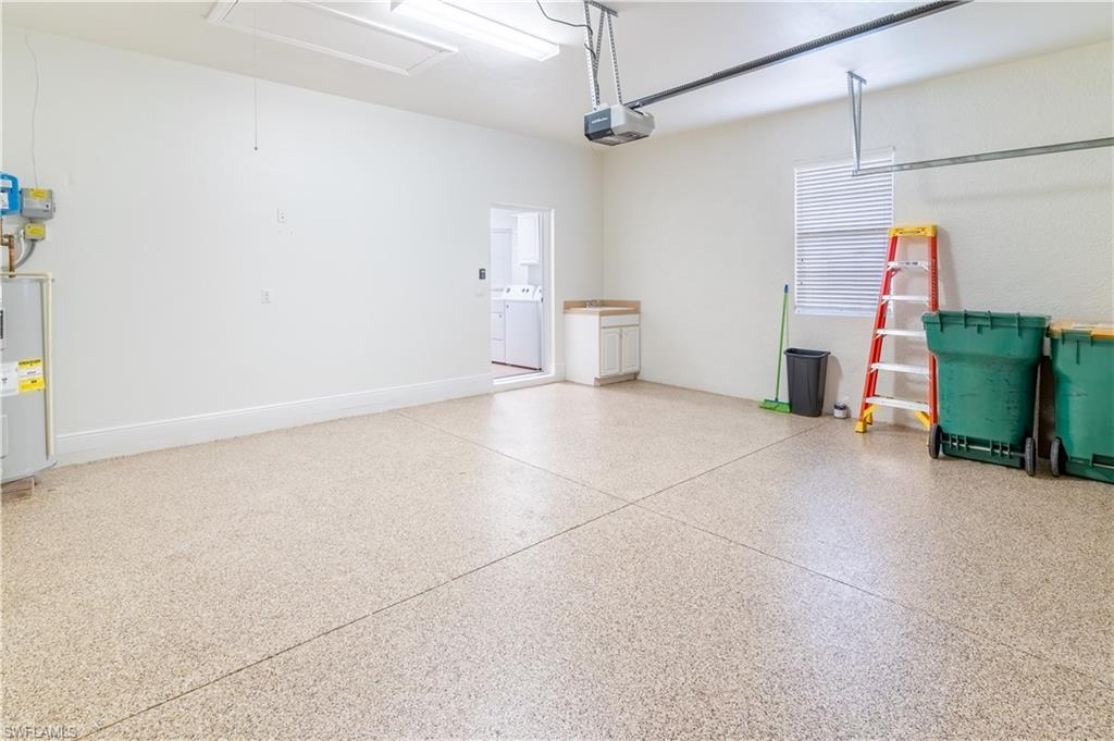15313 Cortona Way Naples, FL 34120 - Photo 14 of 28 a view of a storage & utility room
