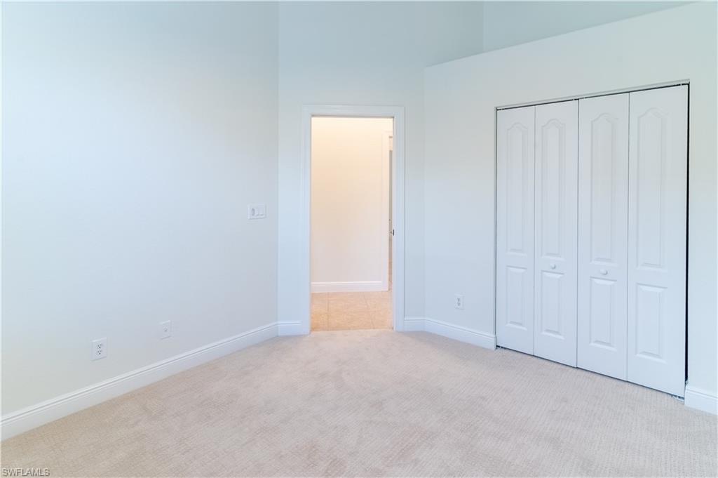 15313 Cortona Way Naples, FL 34120 - Photo 16 of 28 a view of an empty room