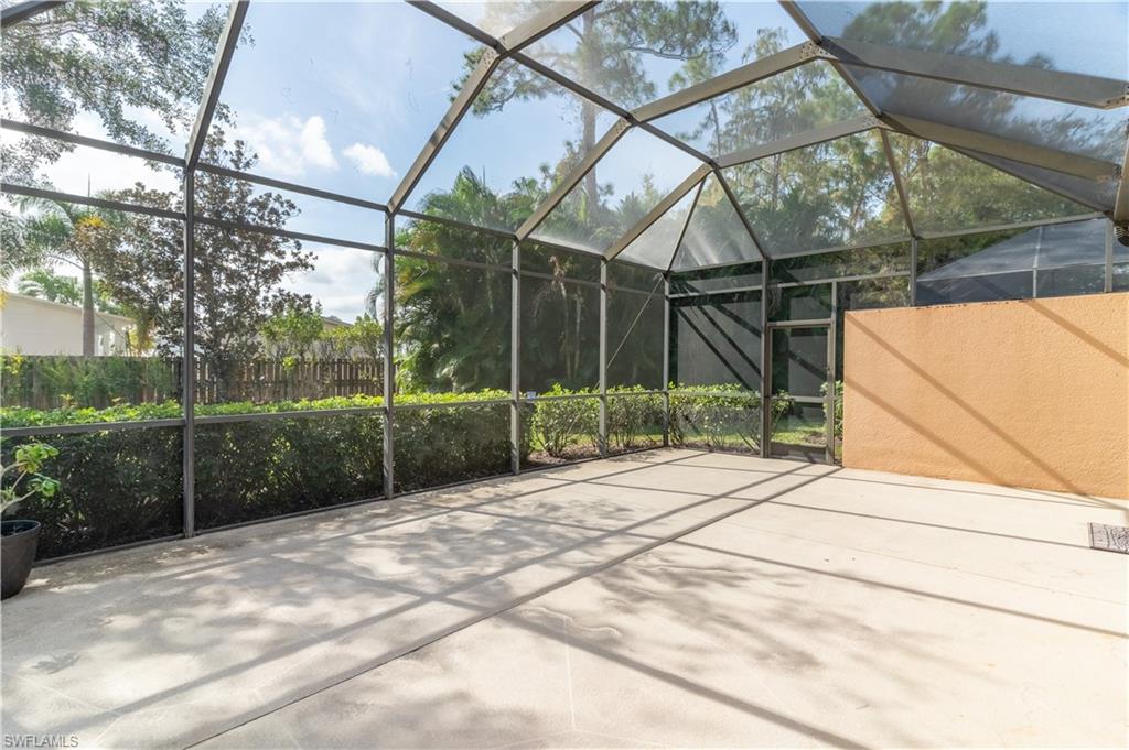 15313 Cortona Way Naples, FL 34120 - Photo 19 of 28 a view of a yard with basketball court