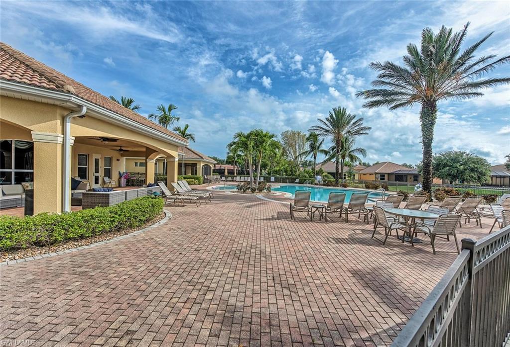 15313 Cortona Way Naples, FL 34120 - Photo 22 of 28 a view of a chairs and table in the patio