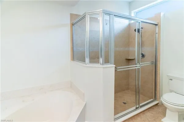 a bathroom with a shower and toilet