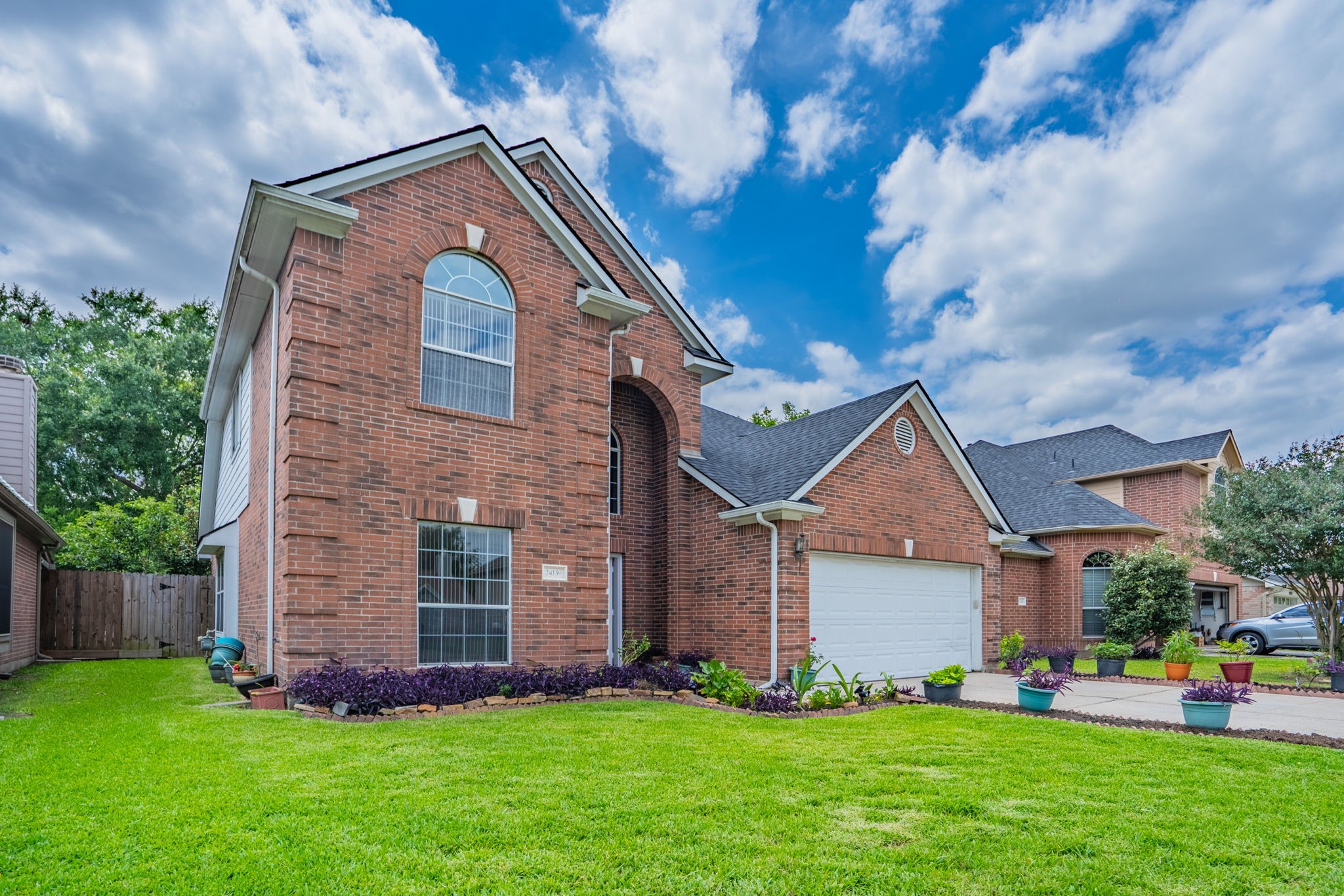 24139 Spring Sunset Drive Spring, TX 77373 - Photo 2 of 26 a front view of a house with a yard