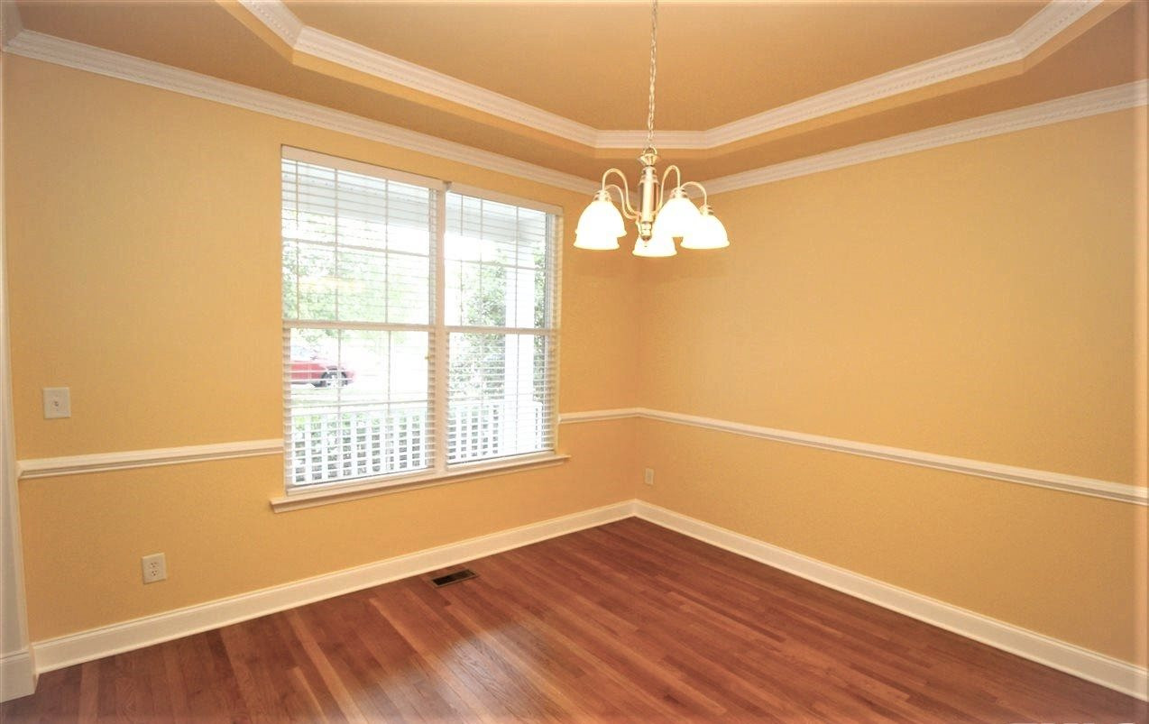 201 Riley Oaks Lane Apex, NC 27539 - Photo 5 of 29 Stunning Formal Dining Room with upgraded trim and molding! Refinished hardwoods and 5 inch baseboards throughout main level! Dining Room