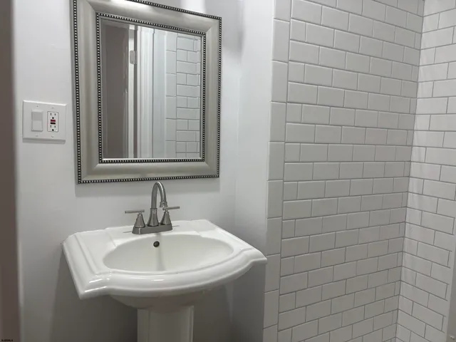 a white sink sitting next to a white sink