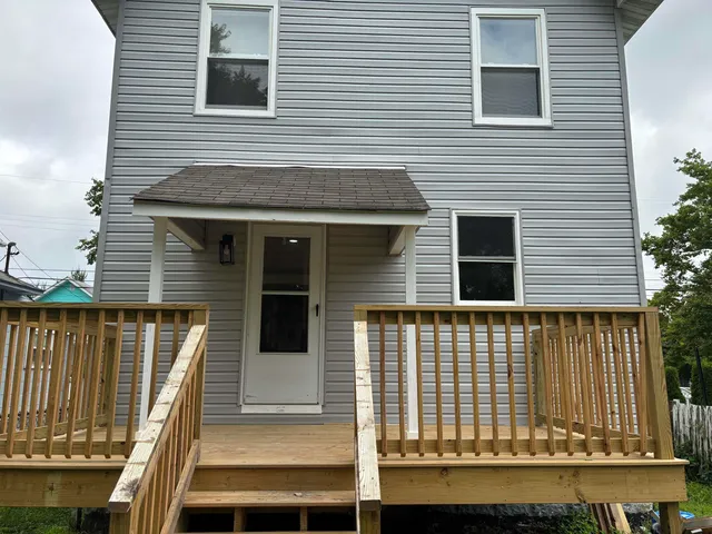 a couple of cars parked in front of a building