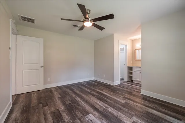 a bathroom with a toilet and tub