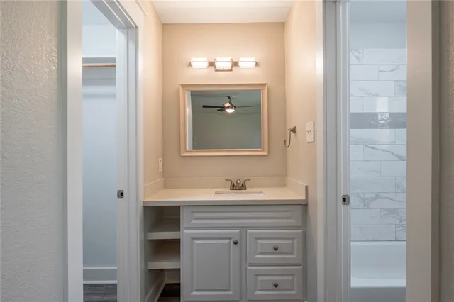 a bathroom with a bathtub and shower