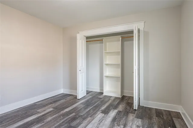 a view of a house with a yard and a garage