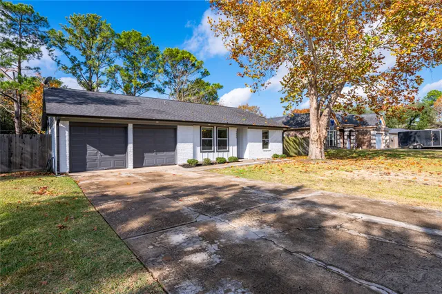 a house with swimming pool in front of it