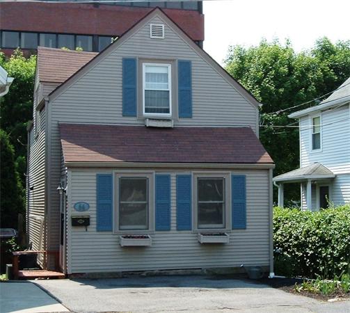 64 Lincoln Road Newton, MA 02458 - Photo 1 of 1 a front view of a house with windows