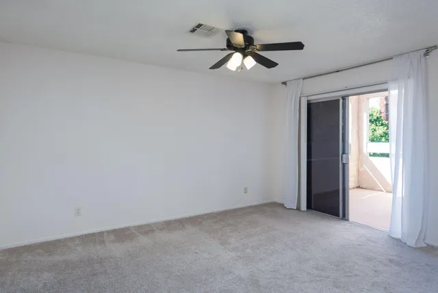 a front view of a house with plants