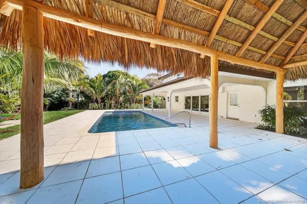 a view of a backyard of the house