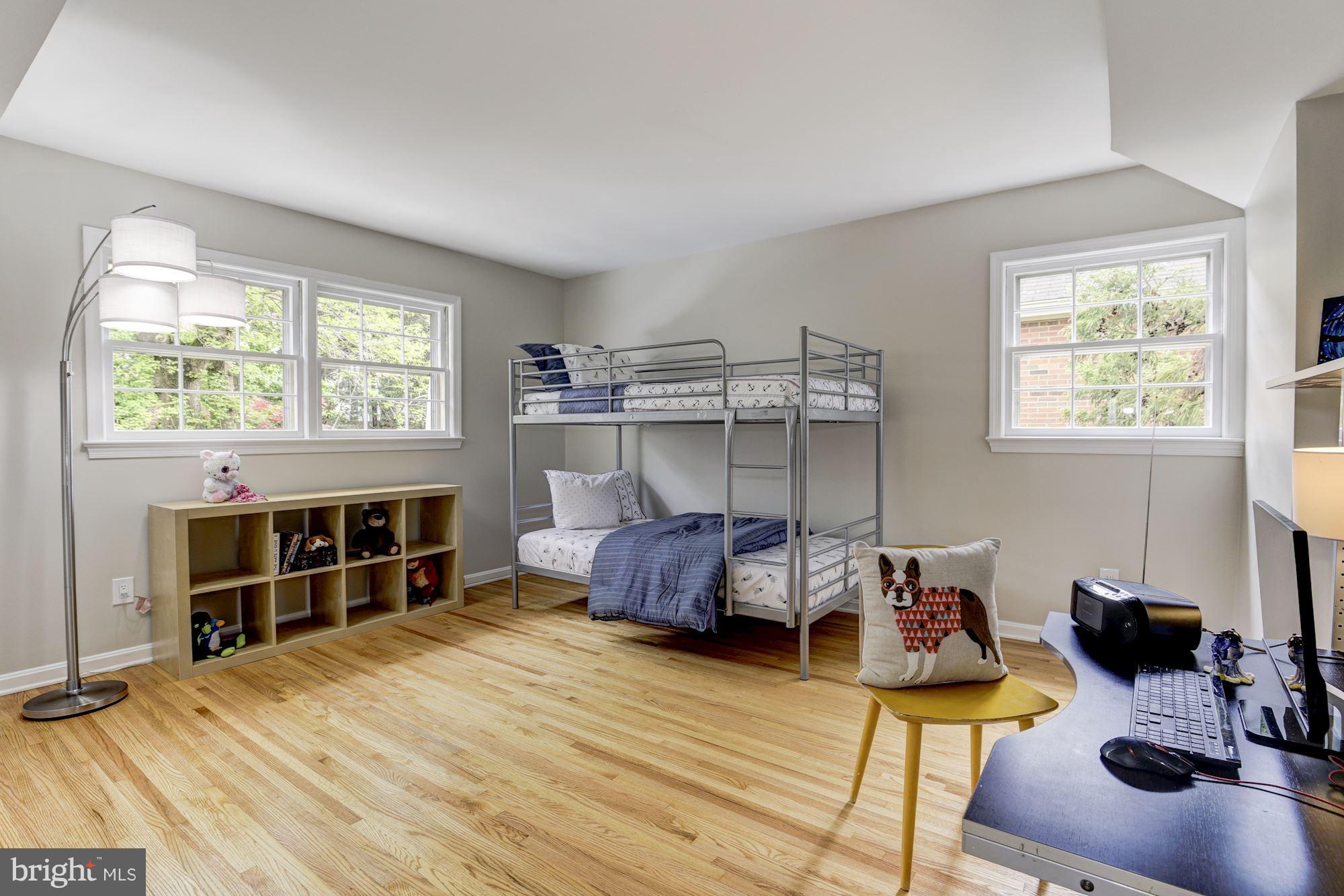 4801 Little Falls Road Arlington, VA 22207 - Photo 14 of 28 a bedroom with a bed and a wooden floor
