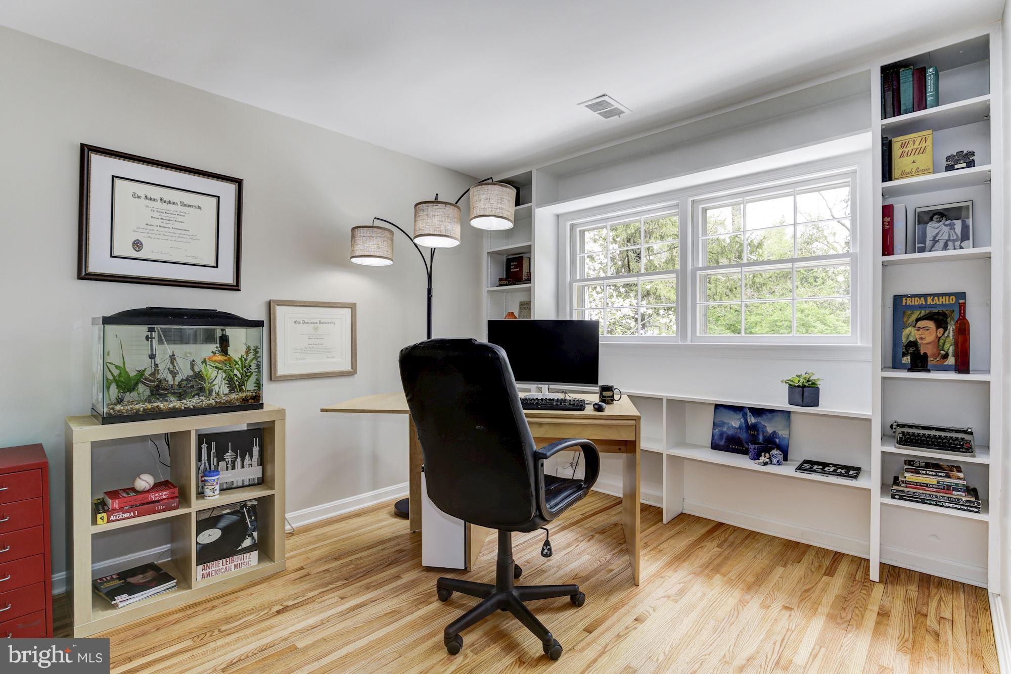 4801 Little Falls Road Arlington, VA 22207 - Photo 16 of 28 a view of a workspace with furniture and a window