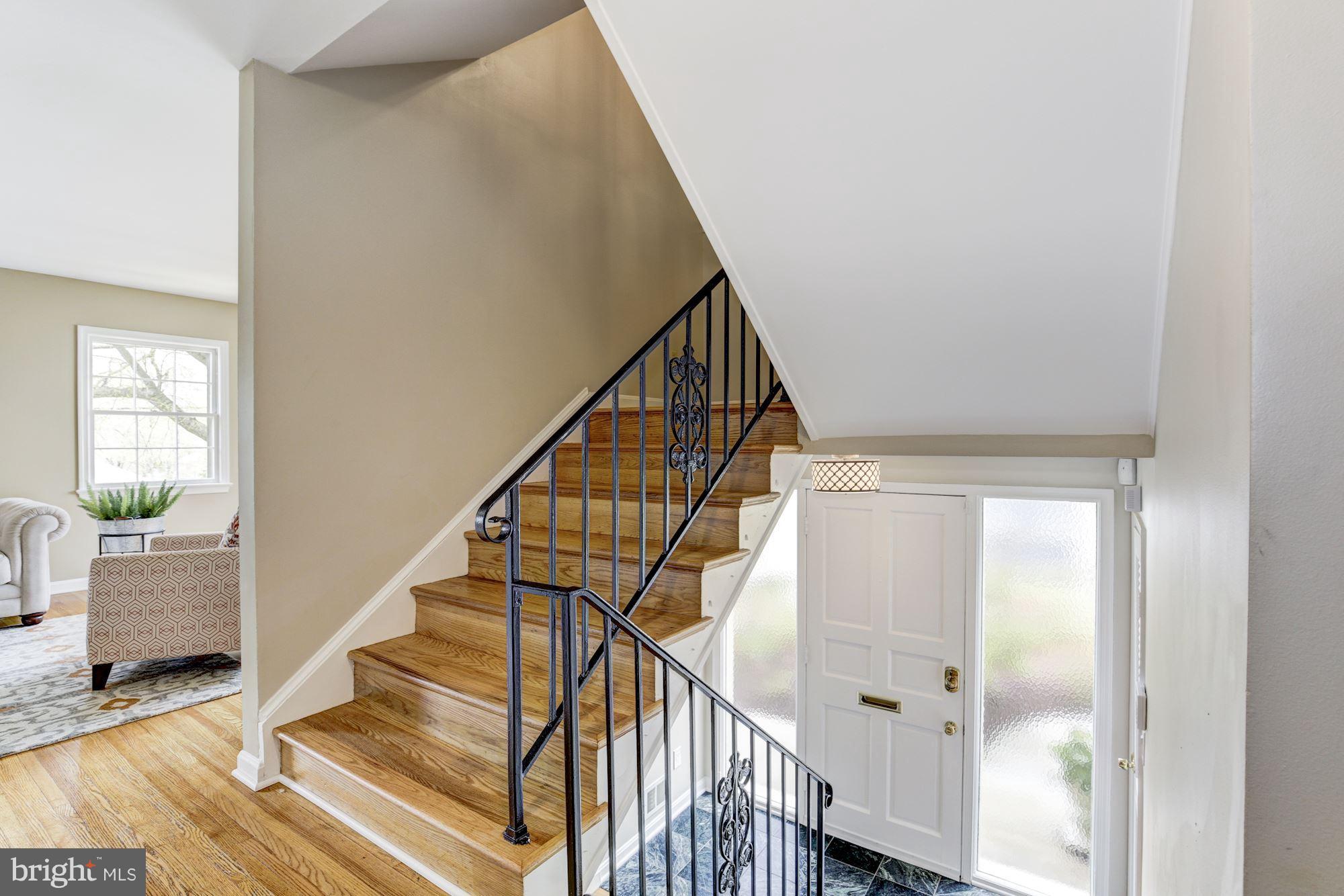 4801 Little Falls Road Arlington, VA 22207 - Photo 3 of 28 a view of entryway with wooden floor and stairs