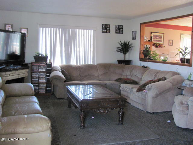 110 Klockhamer Road Naches, WA 98937 - Photo 2 of 3 a living room with furniture and a flat screen tv