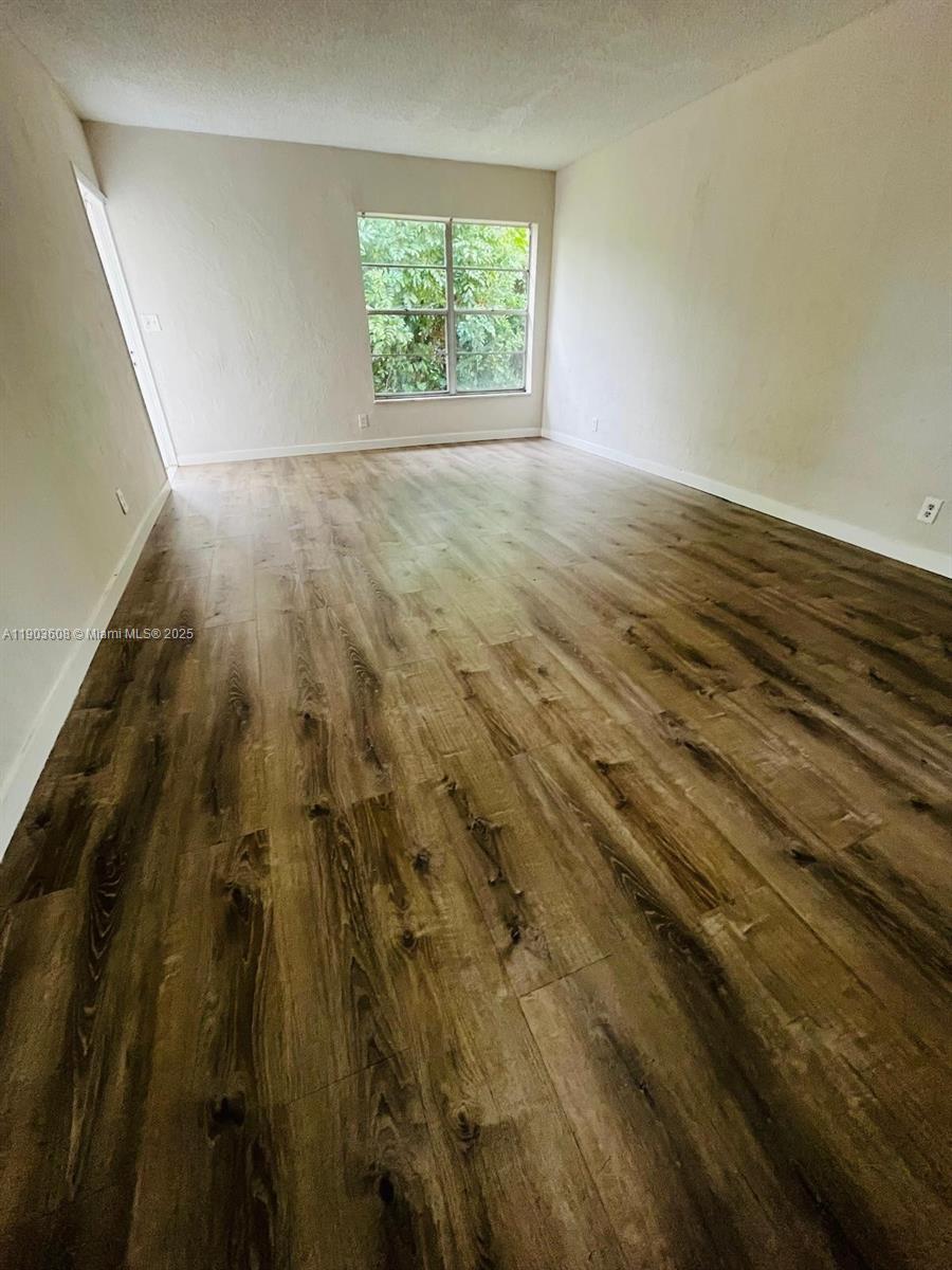 7740 Southwest 10th Street, Unit 1 North Lauderdale, FL 33068 - Photo 11 of 24 a view of an empty room and window