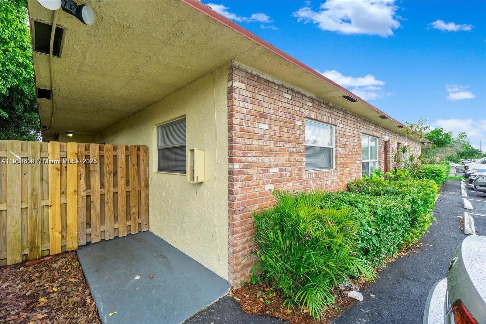 7740 Southwest 10th Street, Unit 1 North Lauderdale, FL 33068 - Photo 12 of 24 a view of backyard with potted plants