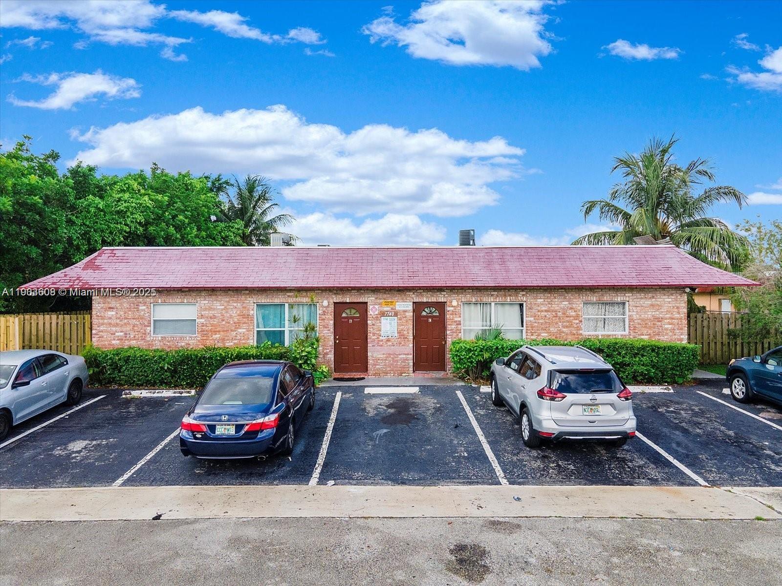 7740 Southwest 10th Street, Unit 1 North Lauderdale, FL 33068 - Photo 17 of 24 a car parked in front of a house