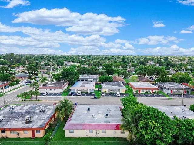 an aerial view of a houses with a street